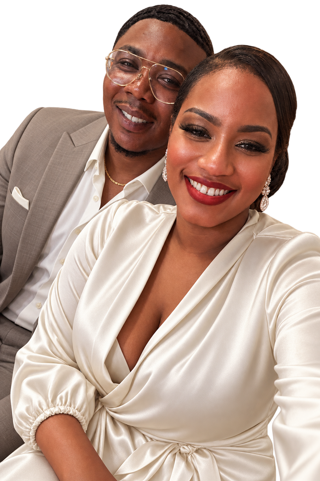 Duane and Andrea smiling together in champagne and ivory wedding attire